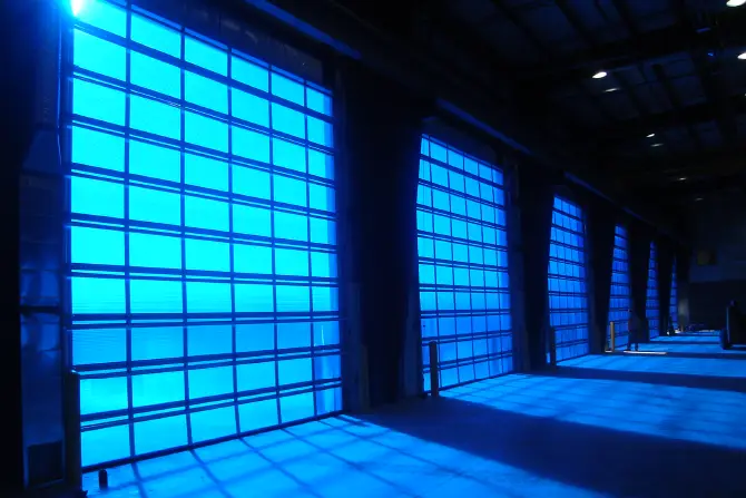 Blue polycarbonate Sunshine doors in an idustrial wearhouse.