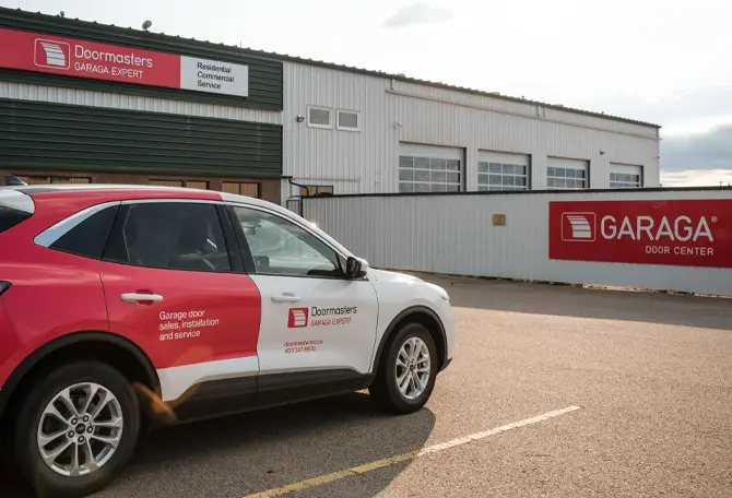 Doormasters' storefront with one of their service vehicles.